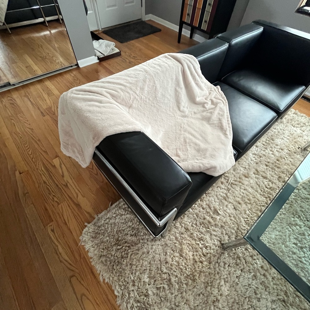 Kanata cream colored 50” x 60” Sherpa plush throw.  100% polyester. Comfy!